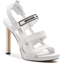 Sandały MICHAEL MICHAEL KORS - Demi Sandal 40S9DEHA1L Optic White. Białe sandały MICHAEL Michael Kors, bez wzorów, ze skóry, bez obcasa, na obcasie, bez zapięcia. W wyprzedaży za 479.00 zł.