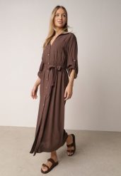 Brązowa Bawełniana Sukienka Koszulowa z Paskiem i Regulowanymi Rękawami Sadevia. Brązowe sukienki Born2be, do pracy, l, bez wzorów, z bawełny, biznesowe, bez kołnierzyka, bez ramiączek, maxi, koszulowe. Za 119.99 zł.