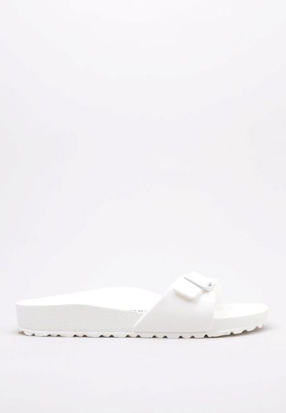 Klapki damskie Birkenstock Eva Madrid. Białe klapki Birkenstock, bez wzorów, z materiału, bez obcasa. Za 169.00 zł.