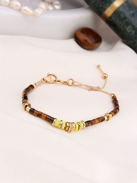 Charlize Pozłacana bransoletka z tygrysim okiem rozmiar: onesize. Brązowe bransoletki Charlize, pozłacane. Za 78.10 zł.