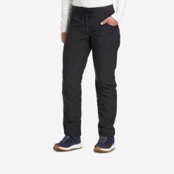 Spodnie turystyczne damskie Quechua NH100 Warm. Czarne spodnie sportowe QUECHUA, l, bez wzorów, z materiału, trekkingowe. Za 129.99 zł.