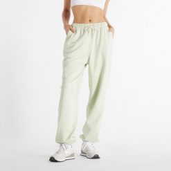 Spodnie damskie New Balance WP41513NUM – miętowe. Zielone spodnie dresowe New Balance, m, bez wzorów, z bawełny. Za 169.99 zł.