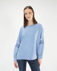 Niebieska bluzka z bawełny. Niebieskie bluzki Unisono, m, bez wzorów, z bawełny, bez kołnierzyka, bez ramiączek. Za 189.00 zł.