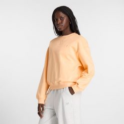 Bluza damska New Balance WT41500PAE – pomarańczowa. Brązowe bluzy New Balance, xl, bez wzorów, z bawełny, bez kaptura. Za 169.99 zł.