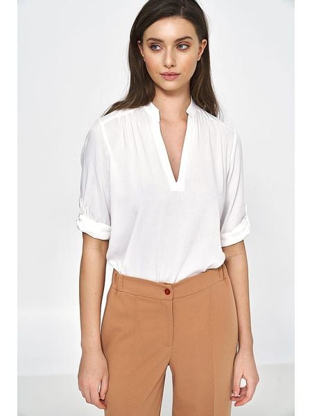 Nife Bluzka w kolorze kremowym rozmiar: 40. Brązowe bluzki Nife, bez wzorów, z wiskozy, bez kołnierzyka, bez ramiączek. Za 139.87 zł.