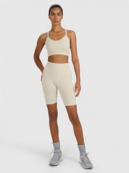 4F Legginsy kolarki treningowe bezszwowe damskie - beżowe M/L. Brązowe legginsy 4f, l, bez wzorów, z dzianiny, z podwyższonym stanem, krótkie. Za 119.99 zł.