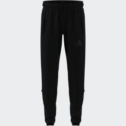 Spodnie piłkarskie ADIDAS Tiro Travel 26 treningowe. Spodnie sportowe Adidas, l, bez wzorów, z dresówki, do piłki nożnej. Za 289.99 zł.