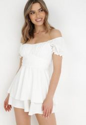 Biały Kombinezon Rhodosyne. Białe sukienki Born2be, na imprezę, m, bez wzorów, eleganckie, bez kołnierzyka, bez ramiączek, mini. Za 109.99 zł.
