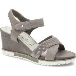 Szare Sandały Damskie Tamaris Buty Na Koturnie. Szare sandały Tamaris, bez wzorów, z materiału, bez obcasa, na koturnie, bez zapięcia. Za 189.00 zł.
