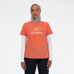 Koszulka damska New Balance WT41816GFR – pomarańczowa. Brązowe bluzki New Balance, l, bez wzorów, z materiału, eleganckie, bez kołnierzyka, bez ramiączek. Za 69.99 zł.