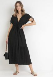 Czarna Rozkloszowana Sukienka z Falbaną Atina. Czarne sukienki Born2be, na imprezę, l, bez wzorów, bez kołnierzyka, bez ramiączek, maxi, rozkloszowane. Za 139.99 zł.