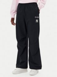 Champion Spodnie dresowe 117977 Czarny Loose Fit. Czarne spodnie dresowe Champion, s, bez wzorów, z dresówki. Za 159.99 zł.