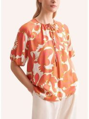 Seidensticker Bluzka w kolorze pomarańczowo-białym rozmiar: 38. Pomarańczowe bluzki Seidensticker, bez wzorów, z wiskozy, bez kołnierzyka, bez ramiączek. Za 213.95 zł.