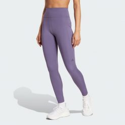 Legginsy Own the Run 7/8. Fioletowe legginsy sportowe Adidas, xl, bez wzorów, z materiału, do biegania. Za 279.00 zł.