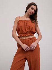 BGN Top w kolorze pomarańczowym rozmiar: 38. Pomarańczowe topy BGN, bez wzorów, z bawełny, bez kołnierzyka, bez ramiączek. Za 84.01 zł.