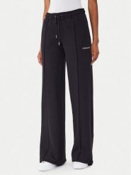 Guess Jeans Spodnie dresowe W5BB04 KC811 Czarny Wide Leg. Czarne spodnie dresowe Guess Jeans, m, z aplikacjami, z bawełny. Za 299.99 zł.