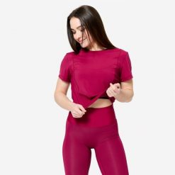 Koszulka fitness damska Domyos krótki rękaw. Fioletowe bluzki DOMYOS, l, bez wzorów, z elastanu, sportowe, bez kołnierzyka, bez ramiączek. Za 69.99 zł.