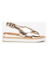 Unisa Skórzane sandały w kolorze złotym na koturnie rozmiar: 37. Żółte sandały Unisa, bez wzorów, z otwartym noskiem, bez obcasa, na koturnie, bez zapięcia. Za 173.99 zł.