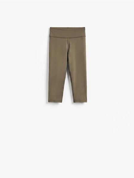 Legginsy capri - ciemnozielony. Zielone legginsy Reserved, l, bez wzorów, z dzianiny. Za 69.99 zł.