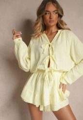 Żółty Kombinezon z Bawełny Ozdobiony Wiązaniem i Falbankami Nalelia. Żółte sukienki Renee, na co dzień, s, bez wzorów, z bawełny, klasyczne, bez kołnierzyka, bez ramiączek, proste. Za 179.99 zł.