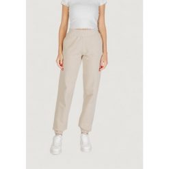 Spodnie Kobieta GUESS ACTIVE PRIMULA RHINESTONES JOGGER. Brązowe spodnie dresowe Guess Active, z aplikacjami. W wyprzedaży za 303.35 zł.