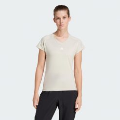 Koszulka AEROREADY Train Essentials Minimal Branding V-Neck. Białe bluzki Adidas, xs, bez wzorów, z materiału, sportowe, bez kołnierzyka, bez ramiączek. Za 109.00 zł.