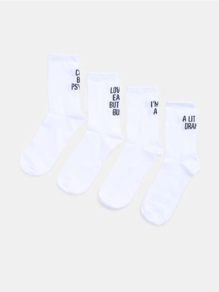 Prążkowane skarpetki z bawełną 4 pack - biały. Białe skarpety Sinsay, bez wzorów, z bawełny. Za 15.99 zł.