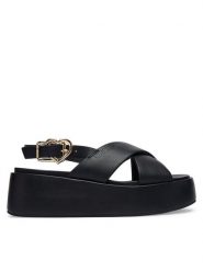 LOVE MOSCHINO Sandały JA16137I0OIA0000 Czarny. Czarne sandały Love Moschino, bez wzorów, ze skóry, bez obcasa, na koturnie, bez zapięcia. Za 919.99 zł.