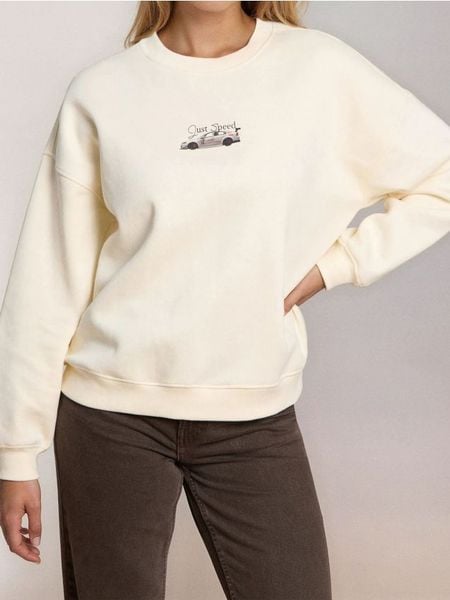 Bluza crewneck z nadrukiem - kremowy. Białe bluzy Sinsay, l, bez wzorów, bez kaptura. Za 49.99 zł.