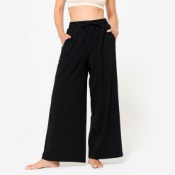 Spodnie dresowe damskie Nyamba Gym & Pilates 520 Flare. Czarne spodnie dresowe NYAMBA, l, bez wzorów, z bawełny, na fitness i siłownię. W wyprzedaży za 99.99 zł.