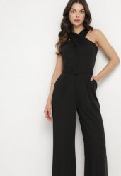 Czarny Taliowany Kombinezon Ozdobiony Paskiem Dollivia. Czarne sukienki Born2be, na co dzień, l, z aplikacjami, eleganckie, bez kołnierzyka, bez ramiączek. Za 139.99 zł.