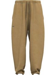 Under Armour Spodnie dresowe "Icon" w kolorze jasnobrązowym rozmiar: S. Brązowe spodnie dresowe Under Armour, s, bez wzorów, z bawełny. Za 188.40 zł.