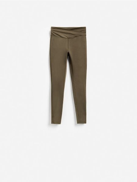 Gładkie legginsy - ciemnozielony. Zielone legginsy Reserved, l, bez wzorów, z dzianiny. Za 89.99 zł.
