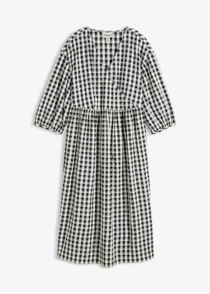 Sukienka midi oversize. Czarne sukienki bonprix, bez wzorów, bez kołnierzyka, bez ramiączek, midi, oversize. Za 99.99 zł.