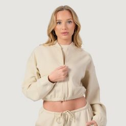 Bluza damska fitness z zamkiem bez kaptura migdałowa NEO. Brązowe bluzy GYMBEAM, l, bez wzorów, z bawełny, bez kaptura. Za 119.90 zł.