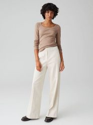 OPUS Spodnie w kolorze kremowym rozmiar: 44. Brązowe spodnie materiałowe Opus, bez wzorów, z materiału, z podwyższonym stanem. Za 143.99 zł.