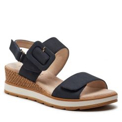Sandały Caprice. Niebieskie sandały Caprice, bez wzorów, bez obcasa, na koturnie, bez zapięcia. Za 269.99 zł.