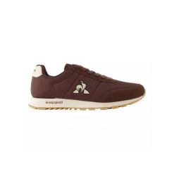 Kapcie LE COQ SPORTIF RACERONE Brązowy. Brązowe obuwie domowe Le Coq Sportif, bez wzorów, bez zapięcia. Za 378.50 zł.