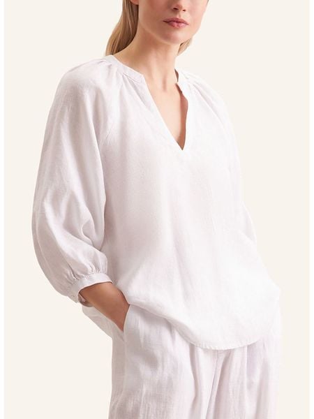 Seidensticker Lniana bluzka w kolorze białym rozmiar: 40. Białe bluzki Seidensticker, bez wzorów, ze lnu, bez kołnierzyka, bez ramiączek. Za 222.94 zł.
