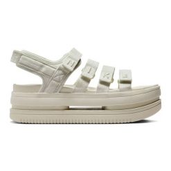 Sandały Nike Icon Classic Se FJ2595-002 beżowy. Brązowe sandały bez wzorów, klasyczne, bez obcasa, bez zapięcia. Za 406.54 zł.
