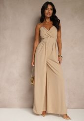 Ciemnobeżowy Kombinezon na Cienkich Ramiączkach z Kopertowym Dekoltem i Szerokimi Nogawkami Jovantia. Brązowe sukienki Renee, na imprezę, l, bez wzorów, eleganckie, bez kołnierzyka, bez ramiączek, kopertowe. Za 139.99 zł.