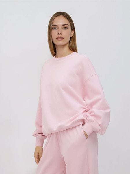 Gładka bluza z bawełną - pastelowy róż. Czerwone bluzy Reserved, l, bez wzorów, z bawełny, bez kaptura. Za 89.99 zł.