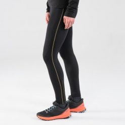 Legginsy do biegania w terenie damskie Kiprun Run 900. Czarne legginsy EVADICT, l, bez wzorów, z materiału, długie. Za 149.99 zł.