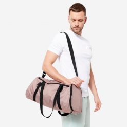 Torba fitness Domyos 20 l. Brązowe torby na ramię DOMYOS, bez wzorów, z materiału, sportowe, na ramię, średnie, bez dodatków. Za 39.99 zł.