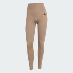 Legginsy Optimé Essentials No Front Rise Seam 7/8. Brązowe legginsy Adidas, xl, bez wzorów. W wyprzedaży za 175.20 zł.
