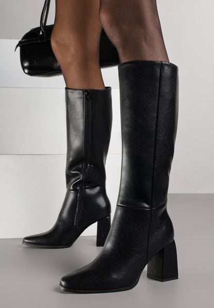 Czarne Eleganckie Kozaki VICES do Kolana ze Skóry Naturalnej na Słupku Reivela. Czarne kozaki Born2be, z jeansu, bez obcasa, na obcasie, bez zapięcia. Za 299.99 zł.