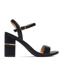 Sandały JENNY. Czarne sandały Jenny, bez wzorów, bez obcasa, na słupku, bez zapięcia. Za 129.99 zł.