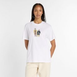Koszulka damska New Balance WT53926WT – biała. Białe bluzki New Balance, xs, bez wzorów, z bawełny, klasyczne, bez kołnierzyka, bez ramiączek. Za 169.99 zł.