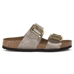 Klapki damskie Birkenstock Sydney. Żółte klapki Birkenstock, bez wzorów, z materiału, bez obcasa. Za 650.60 zł.