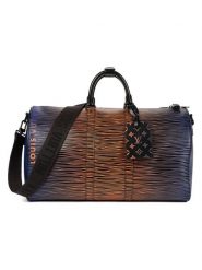 Louis Vuitton Skórzana torba podróżna w kolorze niebiesko-pomarańczowym - 50 x 28 x 23 cm rozmiar: onesize. Niebieskie torby na ramię Louis Vuitton, bez wzorów, z materiału, przez ramię, bez dodatków. Za 17,086.99 zł.